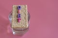 crunchy loaves of bread and a glass of water and the inscription deet on a pink background. Concept of losing weight and healthy