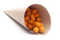 Crunchy Peanut In handmade handcraft brown paper cone bag, made with besan coated peanuts. Pile of Indian spicy snacks