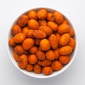 Crunchy Peanut in a white Ceramic bowl, made with besan coated peanuts. Pile of Indian spicy snacks Namkeen,