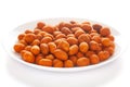 Crunchy Peanut in a white ceramic square plate, made with besan coated peanuts. Royalty Free Stock Photo