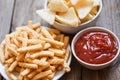 Crunchy prawn crackers or shrimp crisp rice and ketchup for traditional snack - prawn crackers stick on white plate and wooden