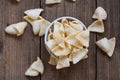 Crunchy prawn crackers or shrimp crisp rice for traditional snack - prawn crackers chips on bowl and wooden table background , top