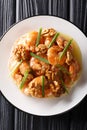 Crunchy shrimp with honey, candied walnut, and sweet mayo close-up. Vertical top view Royalty Free Stock Photo