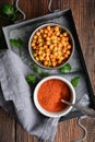 Crunchy snack, crispy and spicy oven roasted chickpea covered in paprika and red chilli powder
