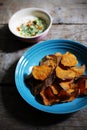 Crunchy sweet potato chips with white dipping sauce with spices, healthy snack Royalty Free Stock Photo