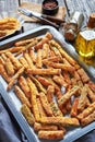 Crunchy zucchini sticks on a baking tray