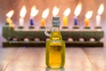 Cruse of oil, Hanukkah with A stone menorah and candles background