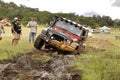 Crush Beige Jeep Rubicon crossing mud obstacle Royalty Free Stock Photo