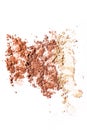 Crushed blusher dispersed on white background. Royalty Free Stock Photo