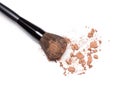 Crushed bronzing powder with makeup brush Royalty Free Stock Photo