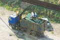 Crushed car being picked up by a grabber. An accident car has been loaded onto a dumptruck by crane. loader crane machine loading