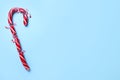 Crushed Christmas candy cane on light blue background, top view. Space for text Royalty Free Stock Photo