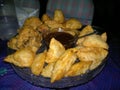 Crushed coconut samosa and pakoras