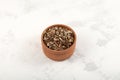 Crushed dried  Arctic-alpine lichen in wooden bowl. Cetraria islandica, also known as true Iceland lichen or Iceland moss. Royalty Free Stock Photo