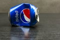 A crushed empty Pepsi can.