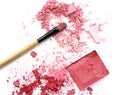 Crushed eye shadows with box and make up brush as a background. Royalty Free Stock Photo
