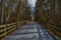 Biker Crosses Crushed Stone Path Bridge at Henlopen State Park`s Junction Royalty Free Stock Photo