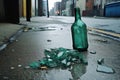 crushed glass bottle on gritty urban sidewalk