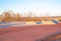 Crushed gravel piles up heap at construction site near warehouse district North of Oklahoma City, truck tire tread machinery