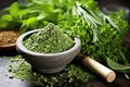 crushed herbs in a stone mortar and pestle Royalty Free Stock Photo