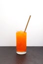 Crushed ice with red orange flavor. Orange granizado in tall glass. Vertical orientation, selective focus, copy space Royalty Free Stock Photo