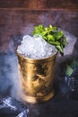 Crushed ice in a tin can on the table. Royalty Free Stock Photo