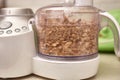 Crushed kernel walnuts in food processor