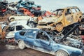 Crushed cars stacked up for recycling.