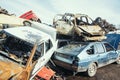 Crushed cars stacked up for recycling.