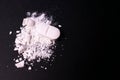 Crushed pill on a black background. Copy space. Drug abuse concept Royalty Free Stock Photo