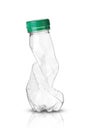 Crushed plastic bottle with green stopper Royalty Free Stock Photo