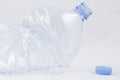 Crushed plastic bottle with lid