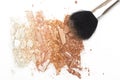 Crushed powder bronzer blush and powder brush on white background Royalty Free Stock Photo