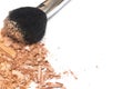 Crushed powder bronzer blush and powder brush on white background Royalty Free Stock Photo