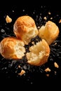 Crushed profiteroles against the black background. Levitating food. French choux pastry dessert
