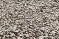 Crushed stone background in perspective. Crushed granite stones close-up. Small rubble, building material rock, gravel texture Royalty Free Stock Photo