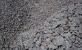 Crushed stone mounds.Grey crushed stones in close up,Versatile building material for horticulture,landscape gardening or road