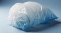 Crushed white and blue plastic bag on a light blue surface Royalty Free Stock Photo