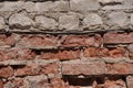 Crushed white and red brick wall