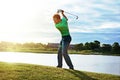 Crushing it on the course. a man practicing his swing on the golf course. Royalty Free Stock Photo