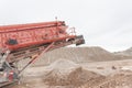 Crushing machinery working on the open pit quarry