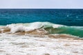 Crushing ocean wave with sand. Royalty Free Stock Photo