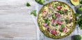 Crust Broccoli base low carbs keto pizza with salami, avocado on vintage newspapper. Top view Royalty Free Stock Photo