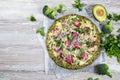 Crust Broccoli base low carbs keto pizza with salami, avocado on vintage newspapper. Top view Royalty Free Stock Photo