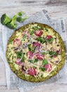 Crust Broccoli base low carbs keto pizza with salami, avocado on vintage newspapper. Top view Royalty Free Stock Photo