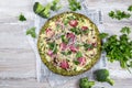 Crust Broccoli base low carbs keto pizza with salami, avocado on vintage newspapper. Top view Royalty Free Stock Photo