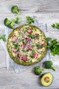 Crust Broccoli base low carbs keto pizza with salami, avocado on vintage newspapper. Top view Royalty Free Stock Photo