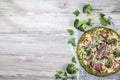 Crust Broccoli base low carbs keto pizza with salami, avocado on vintage newspapper. Top view Royalty Free Stock Photo