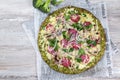 Crust Broccoli base low carbs keto pizza with salami, avocado on vintage newspapper. Top view Royalty Free Stock Photo