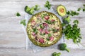 Crust Broccoli base low carbs keto pizza with salami, avocado on vintage newspapper. Top view